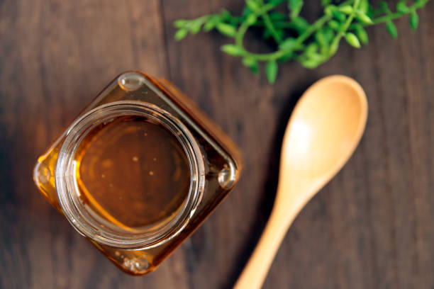istock Honey in a cosmetological jar on the table 1401259210
