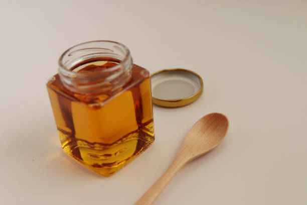 istock Honey in a cosmetological jar on the table 1401259224