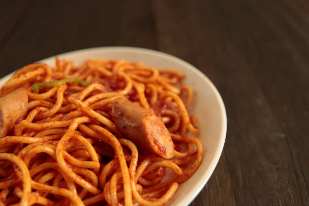 Despite the name, it has no direct connection to Naples (Napoli), Italy, and it's definitely one of those “only-in-Japan” Western-style (yōshoku) dishes that can be a bit controversial, especially among Italian purists. Spaghetti Naporitan is a stir-fried pasta dish made with Ketchup. Also commonly sautéed onions, green bell peppers, and sausages or ham are added.