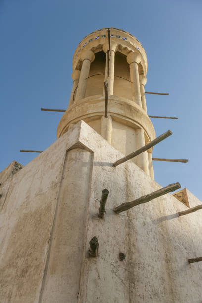 A Round Watchtower in Sharjah Sharjah, UAE - April 14, 2005: The unique round watchtower at Ibrahim Al Midfa's majlis, now a museum, in Sharjah in the United Arab Emirates. sharjah city stock pictures, royalty-free photos & images
