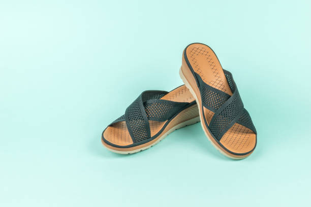 istock Fashionable women's summer mesh sandals on a light blue background. 1401259332
