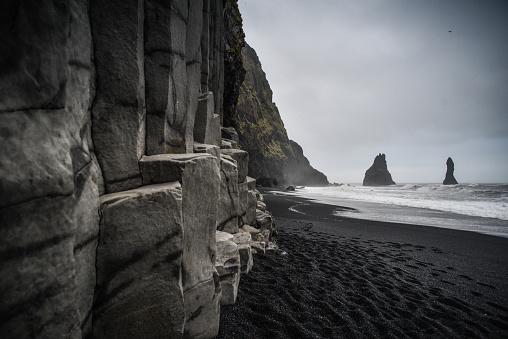 The famous Reyinisfjara black volcanic sand beach with its basalt columns an sea stacks, South Coast, Iceland