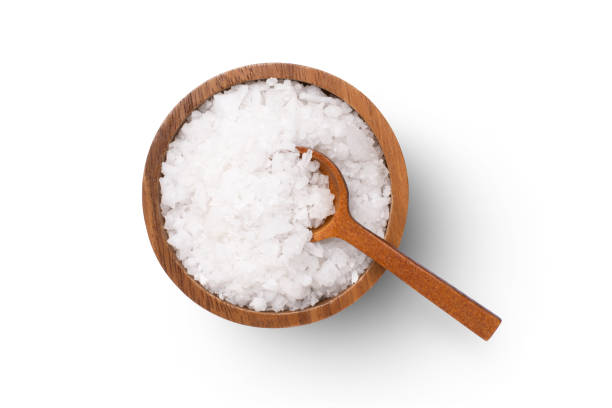 Natural sea salt in wooden bowl stock photo
