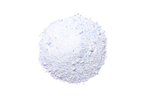 Pile of laundry detergent powder or washing powder isolated on white background. Top view. Flat lay.