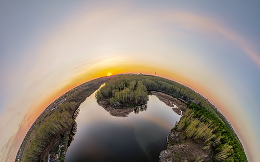 Confluence of the Iset and Kamenka rivers in the city Kamensk-Uralskiy. Iset and Kamenka rivers, Kamensk-Uralskiy, Sverdlovsk region, Ural mountains, Russia. Aerial view. Little planet sphere mode.