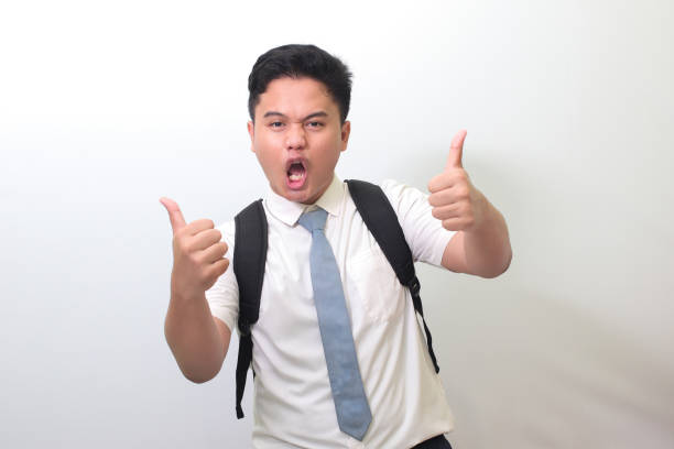 istock high school student making thumbs up hand gesture 1401267184