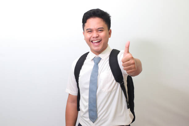 istock high school student making thumbs up hand gesture 1401267190