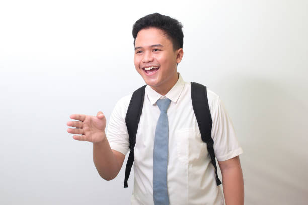 high school student reaching out for a handshake and greet someone