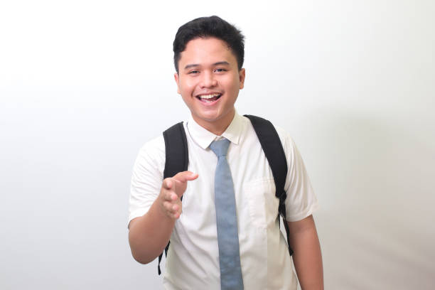 istock high school student reaching out for a handshake and greet someone 1401267249