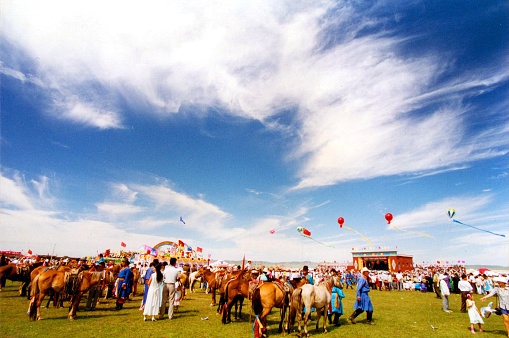China has a large Mongolian population, mainly in the Inner Mongolia region bordering Mongolia.Naadam is the Mongolian annual most solemn national festival.There are horse racing, Mongolian wrestling,Mongolian chess,performances, rallies, trading and other traditional events.Film photo in 28 July 1997,Sonid Youqi, Inner Mongolia,China
