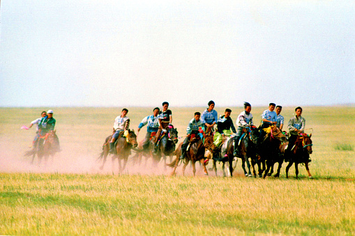 China has a large Mongolian population, mainly in the Inner Mongolia region bordering Mongolia.Naadam is the Mongolian annual most solemn national festival.There are horse racing, Mongolian wrestling,Mongolian chess,performances, rallies, trading and other traditional events.Film photo in 29 July 1997,Sonid Youqi, Inner Mongolia,China