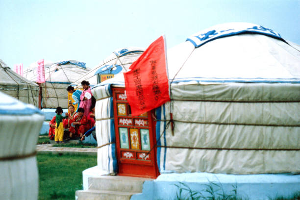 China has a large Mongolian population, mainly in the Inner Mongolia region bordering Mongolia.Naadam is the Mongolian annual most solemn national festival.People dress up and take part in festival activities.Film photo in 28 July 1997,Sonid Youqi, Inner Mongolia,China