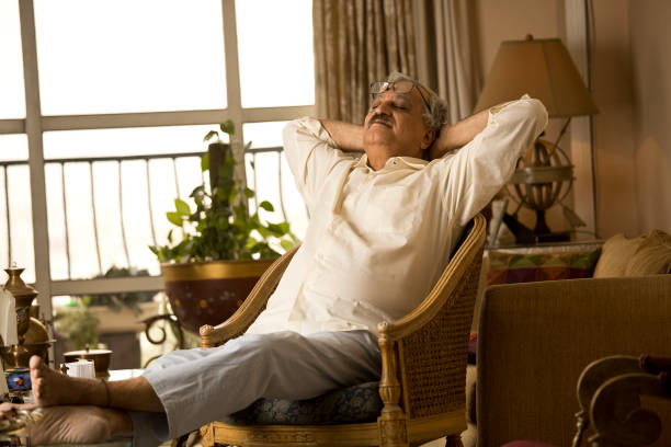 istock Old man sleeping on chair at home 1401272313