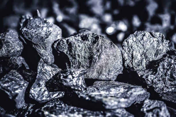 istock Coal miner in the man hands of coal background. Coal mining 1401272551