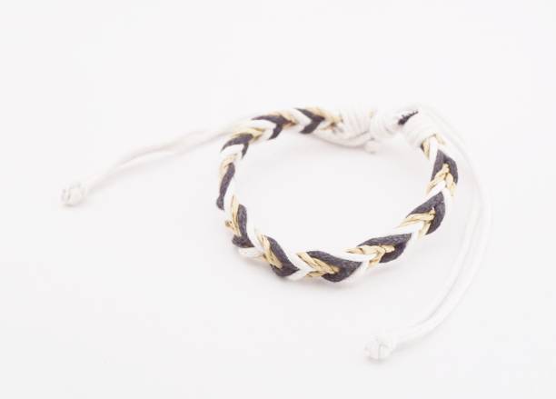 An isolated ethnic bracelet on white background. The bracelet is made off the various rope An isolated ethnic bracelet on white background. The bracelet is made off the various rope assiduity stock pictures, royalty-free photos & images