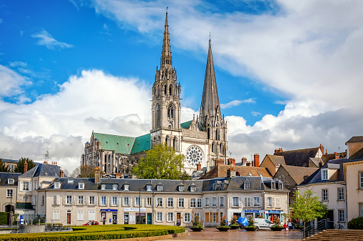 Chartres, France - April 19, 2013: A view to Cathedral Our Lady of Chartres from central place of city. Cathedral constructed during the 13th century and is fine example of French Gothic architecture.