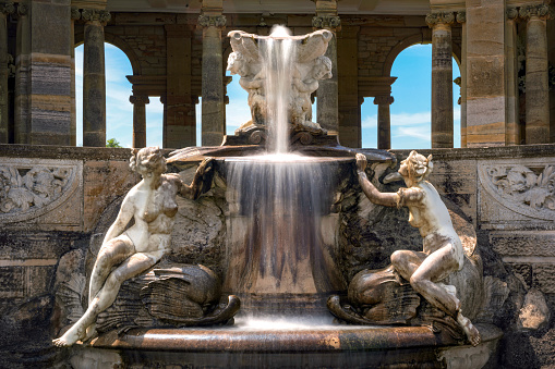 Hever, United Kingdom - June 18, 2015: Fountain in Hever castle Italian garden. Creation was inspired by the Trevi fountain in Rome.