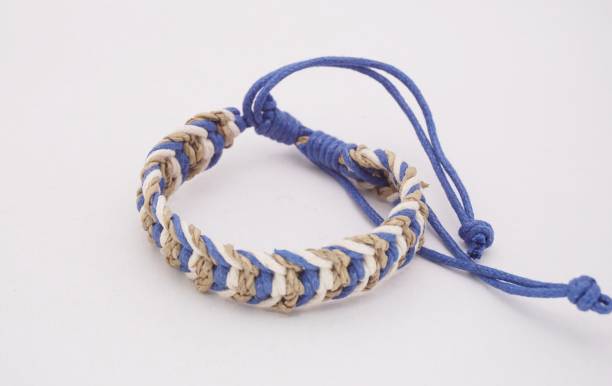 An isolated ethnic bracelet on white background. The bracelet is made off the various rope An isolated ethnic bracelet on white background. The bracelet is made off the various rope assiduity stock pictures, royalty-free photos & images