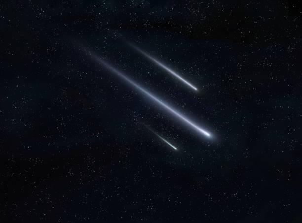 Meteor trails in the night sky, beautiful meteor shower. falling stars. stock photo