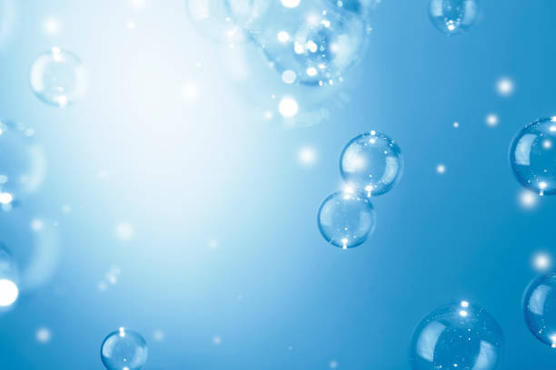 istock Beautiful Shiny Transparent Blue Soap Bubbles Background. Soap Sud Bubbles Water. 1401280728