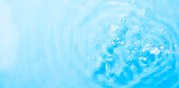 istock Blue gradient water background. Summer blue wave. Abstract or natural wavy water texture background. Defocus. The perfect backdrop for a presentation 1401284257