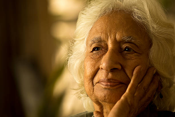 istock Close-up of thoughtful old woman 1401285335