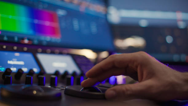 istock Male editor hand working with footage on computer at desk 1401290800