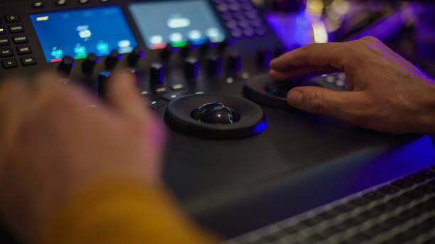 istock Male editor hands working with footage on computer at desk 1401290960