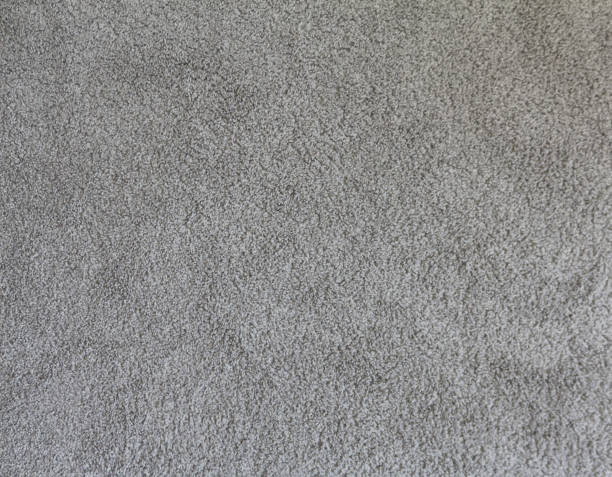 istock Grey soft carpet in monochromatic color. Textile carpeting. Abstract texture background. 1401293952