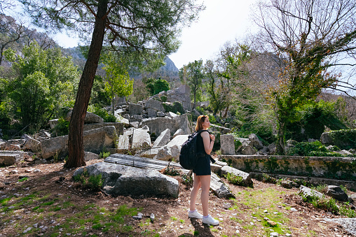 A female traveler exploring the ancient city of Termessos, Antalya.