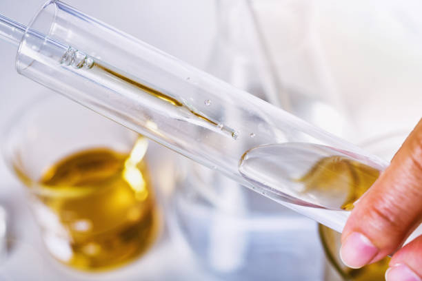 istock Oil dropping, Chemical reagent mixing, Laboratory and science experiments, Formulating the chemical for medical research, Quality control of petroleum industry products concept 1401300976