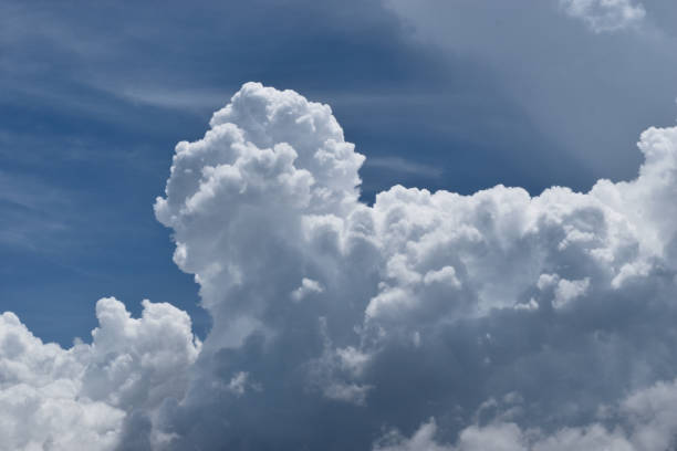 istock Cumulonimbus cloud formations on tropical sky 1401301103