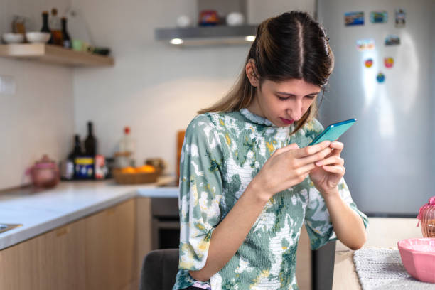 A visually impaired young woman  using smart phone.