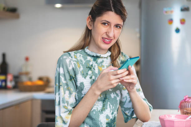 istock A visually impaired young woman  using smart phone. 1401302844