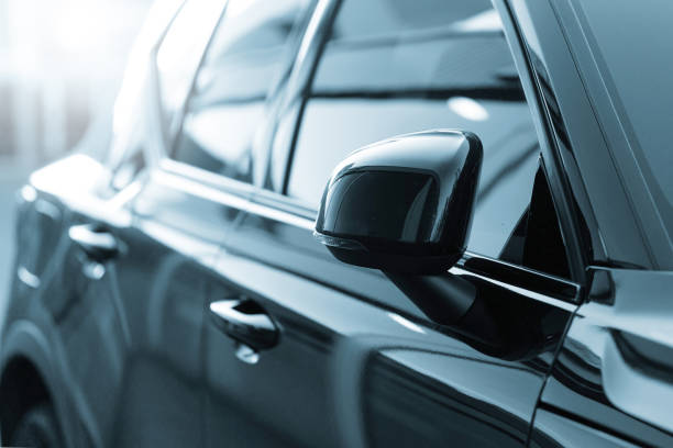 istock Side mirror of a new dark blue car 1401304072