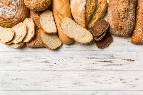 istock Homemade natural breads. Different kinds of fresh bread as background, top view with copy space 1401304277