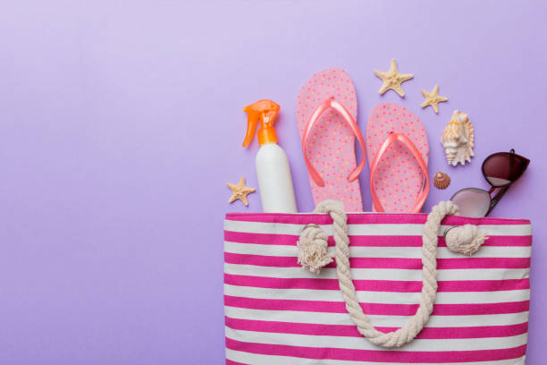 istock beach accessories flat lay top view on colored background Summer travel concept. Bag with starfish and sea shell. Top view 1401304326