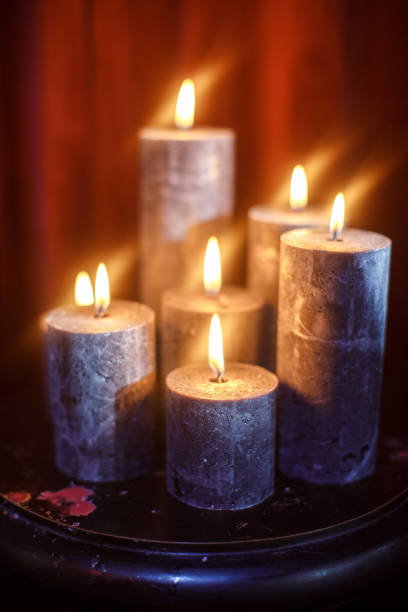 istock Set of burning candles on the table 1401307674
