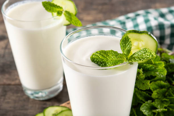 Ayran drink with mint and cucumber in glass stock photo