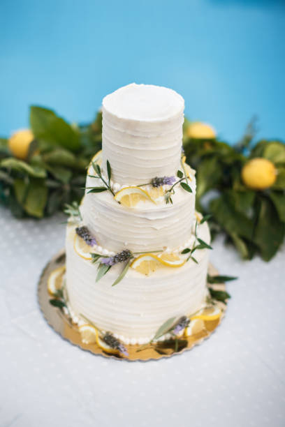 istock Beautiful wedding cake decorated with yellow lemons 1401311079