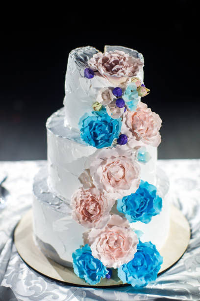 istock Multilevel wedding cake decorated with colorful flower 1401311114