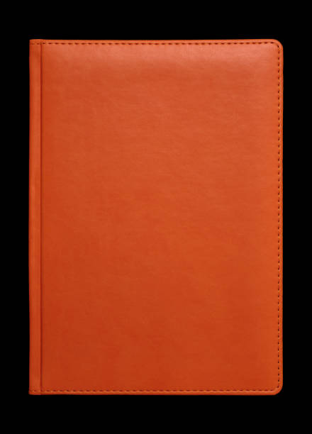 funda de libro de cuero naranja sobre negro - passport blank book cover empty fotografías e imágenes de stock