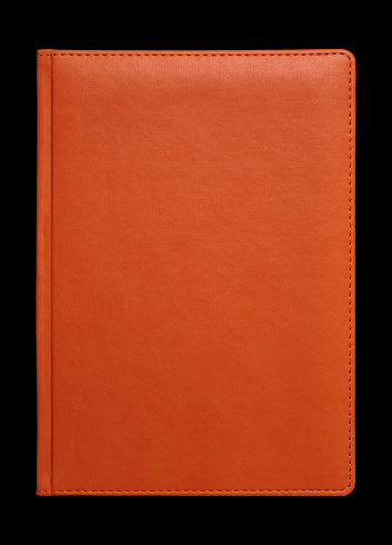 orange leather book cover on black