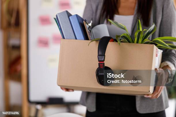 Businesswoman Holding A Cardboard Box With Personal Belongings Stock Photo - Download Image Now