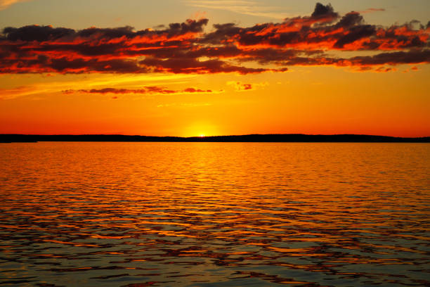 Dramatic sunset sky with clouds. Breathtaking sunset over the sea