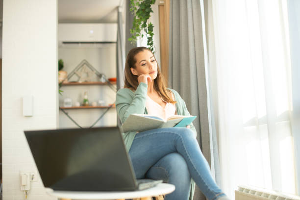 istock Young woman working from home 1401316003