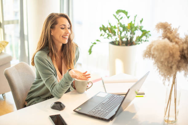 istock Young beautiful woman working from home 1401316310