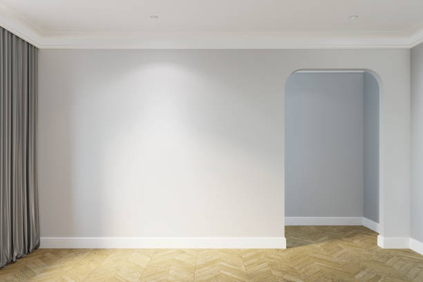istock Empty bright room with an illuminated wall between a window with gray curtains and doorway, parquet floor, and ceiling with built-in lighting. Front view. 1401316523