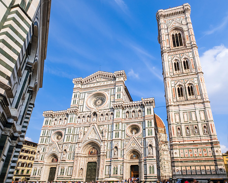 Glimpse of Piazza del Duomo in Florence, where overlooks the cathedral complex: the Cattedrale di Santa Maria del Fiore, the Battistero di San Giovanni and the Giotto's Campanile, all part of the UNESCO World Heritage Site.