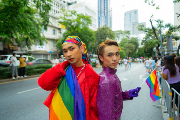 istock Confident Gay Boy Holding Rainbow Flag. 1401319518